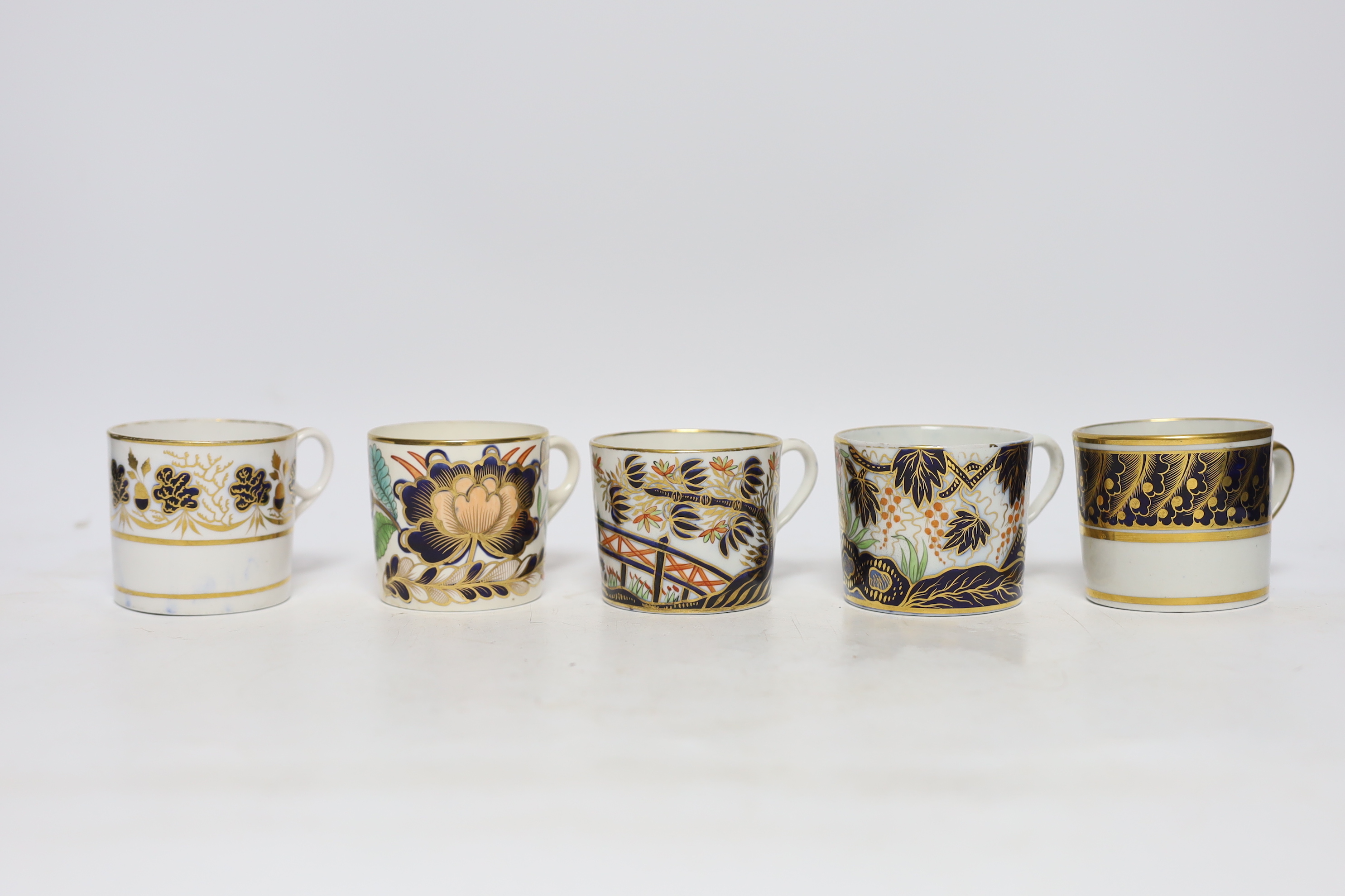 Twelve 1800-1820 English porcelain coffee cans, including Imari pattern examples